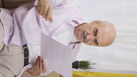 Vertical-video-of-The-old-man-who-frets-over-abusive-paperwork.